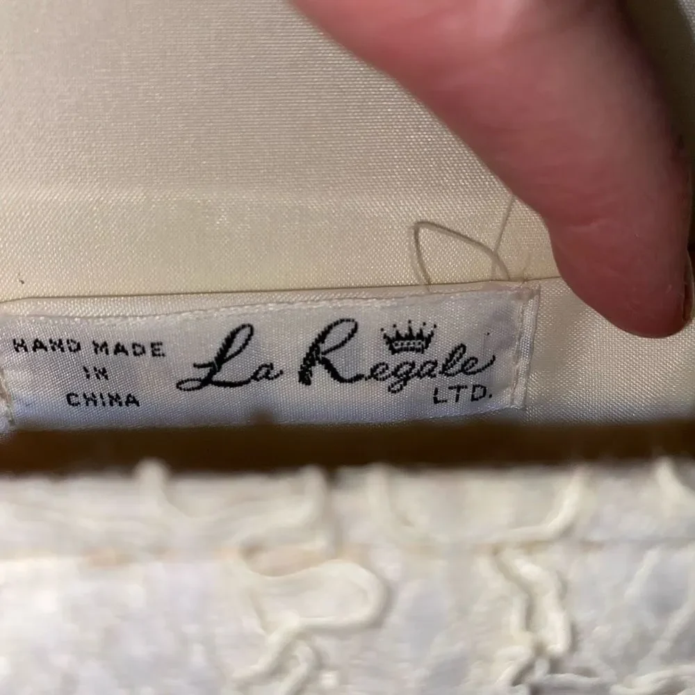 La Regale LTD vintage lace clutch w/nylon chord strap & fringe tassle white